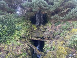 Waterfall feature surrounded by planting at the Royal Botanic Gardens Edinburgh.