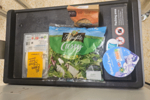Groceries in a bagging section of a supermarket.
