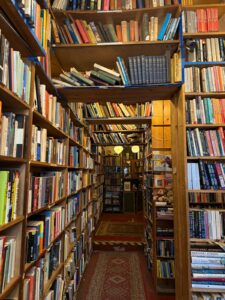 Bookshelves full of books line the walls inside Armchair Books in Edinburgh.