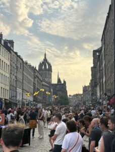 Crowds of people on the Royal Mile during Edinburgh Fringe Festival.