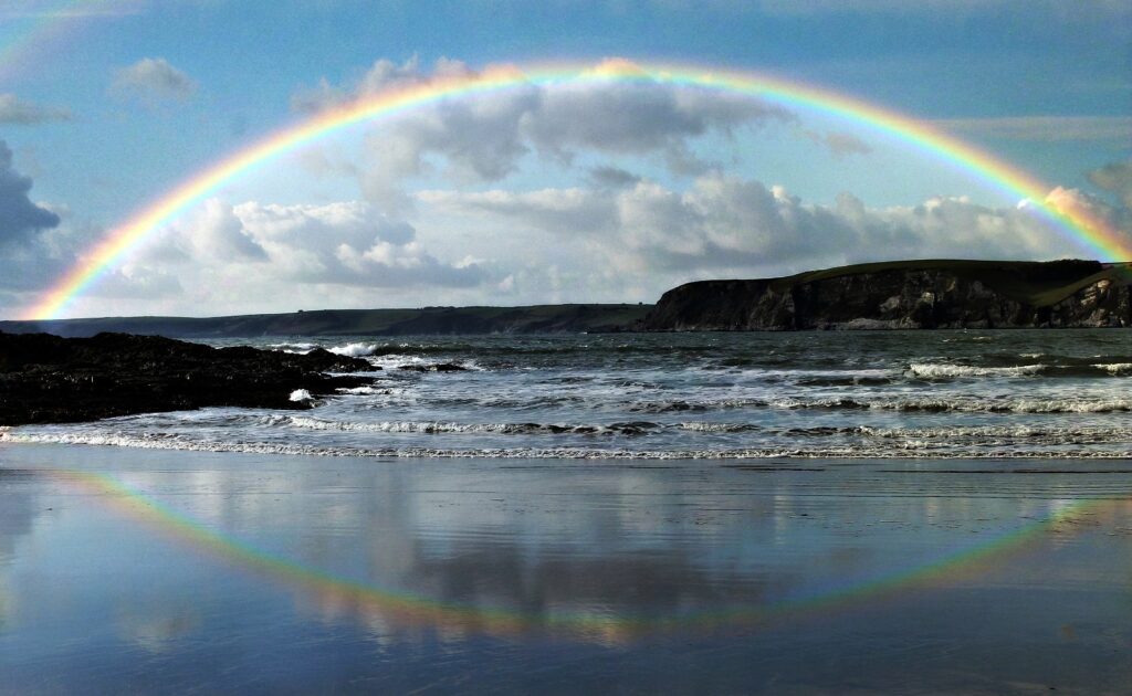 a rainbow over a beach