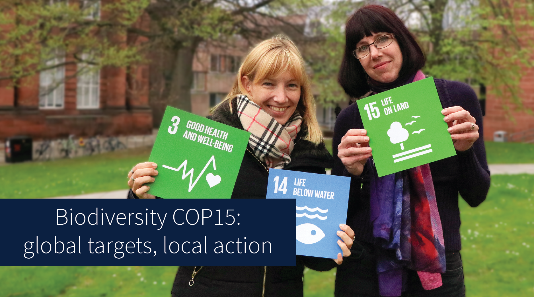 Liz Vander Meer and Kim Vender holding sustainable development goal cards