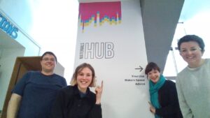 Team with a sign for The Materials Hub