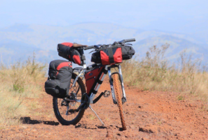 Cycle loaded with panniers on mountain