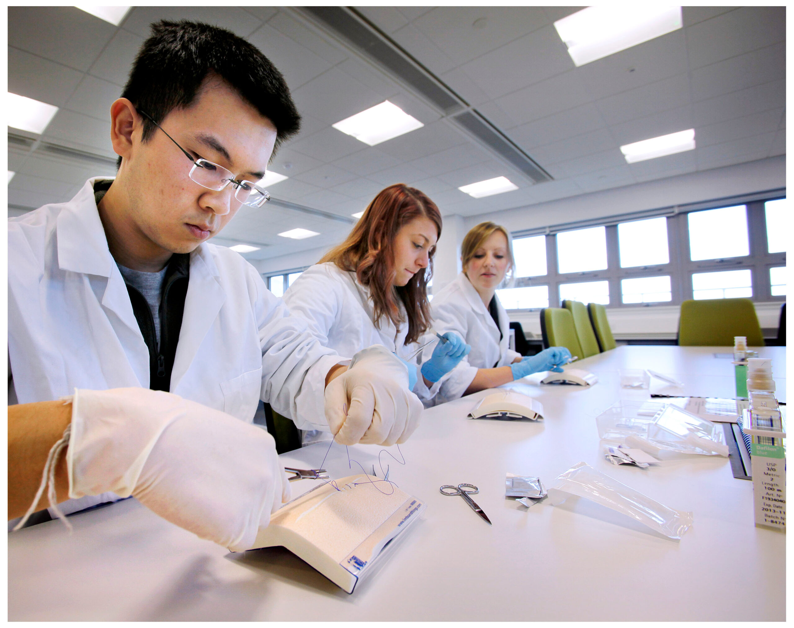 students suturing in a lab