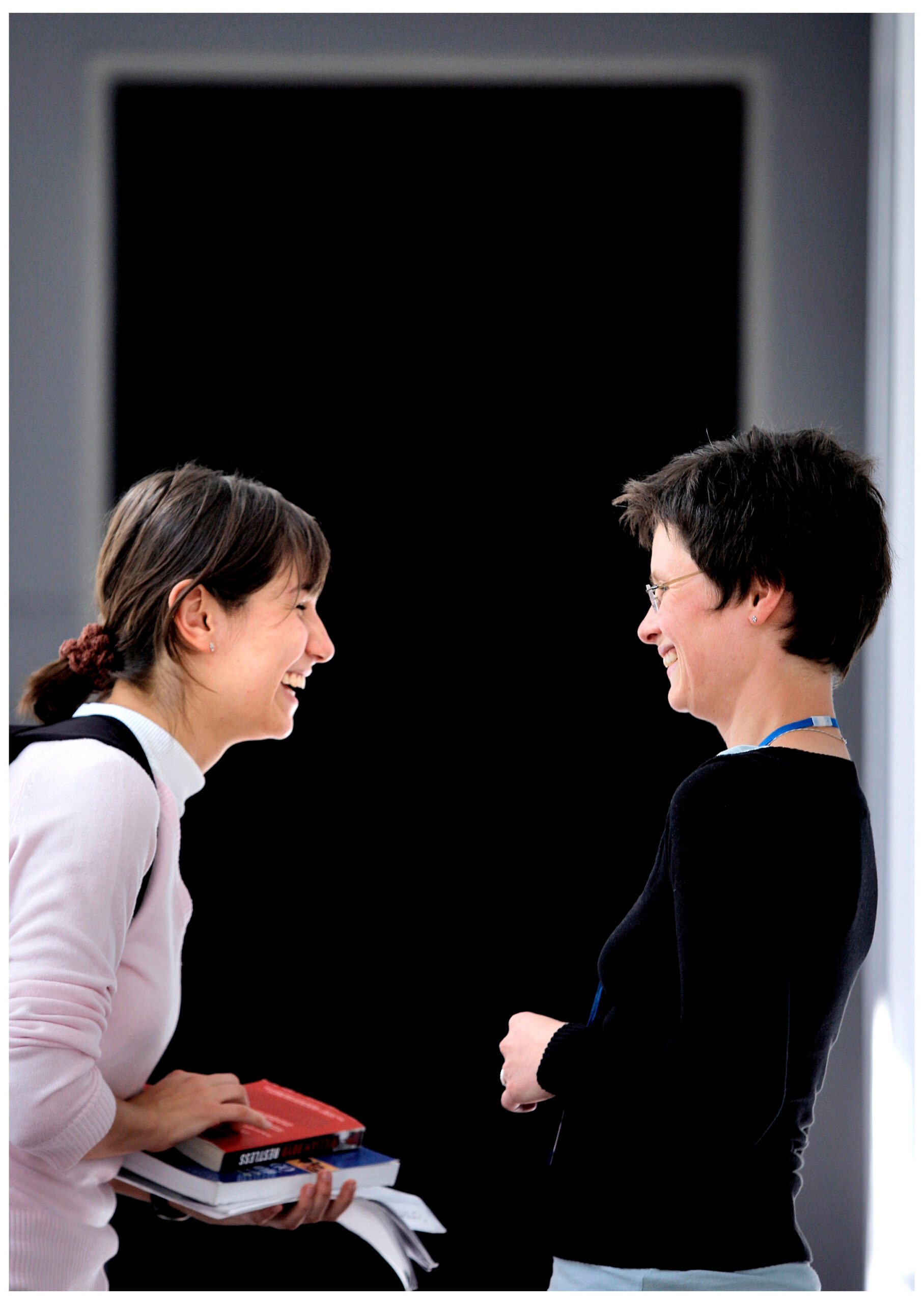 a student and lecturer talk