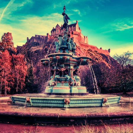 Photograph of the Princes street Gardens showing the fountain and Edinburgh castle