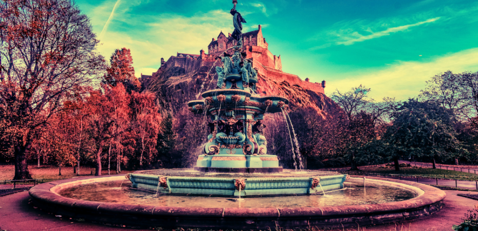 Photograph of the Princes street Gardens showing the fountain and Edinburgh castle