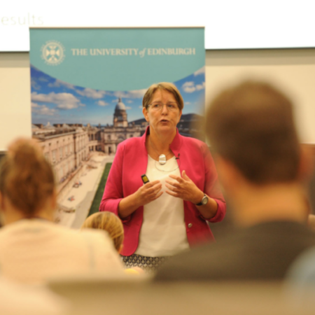 Photograph of the author and key note speaker Irma Meijerman speaking at the Learning and Teaching conference to the audience