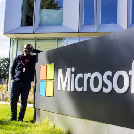 Author standing by the Microsoft sign in Copenhagen