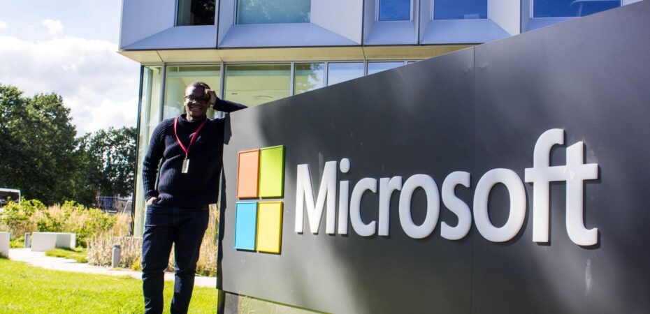 Author standing by the Microsoft sign in Copenhagen