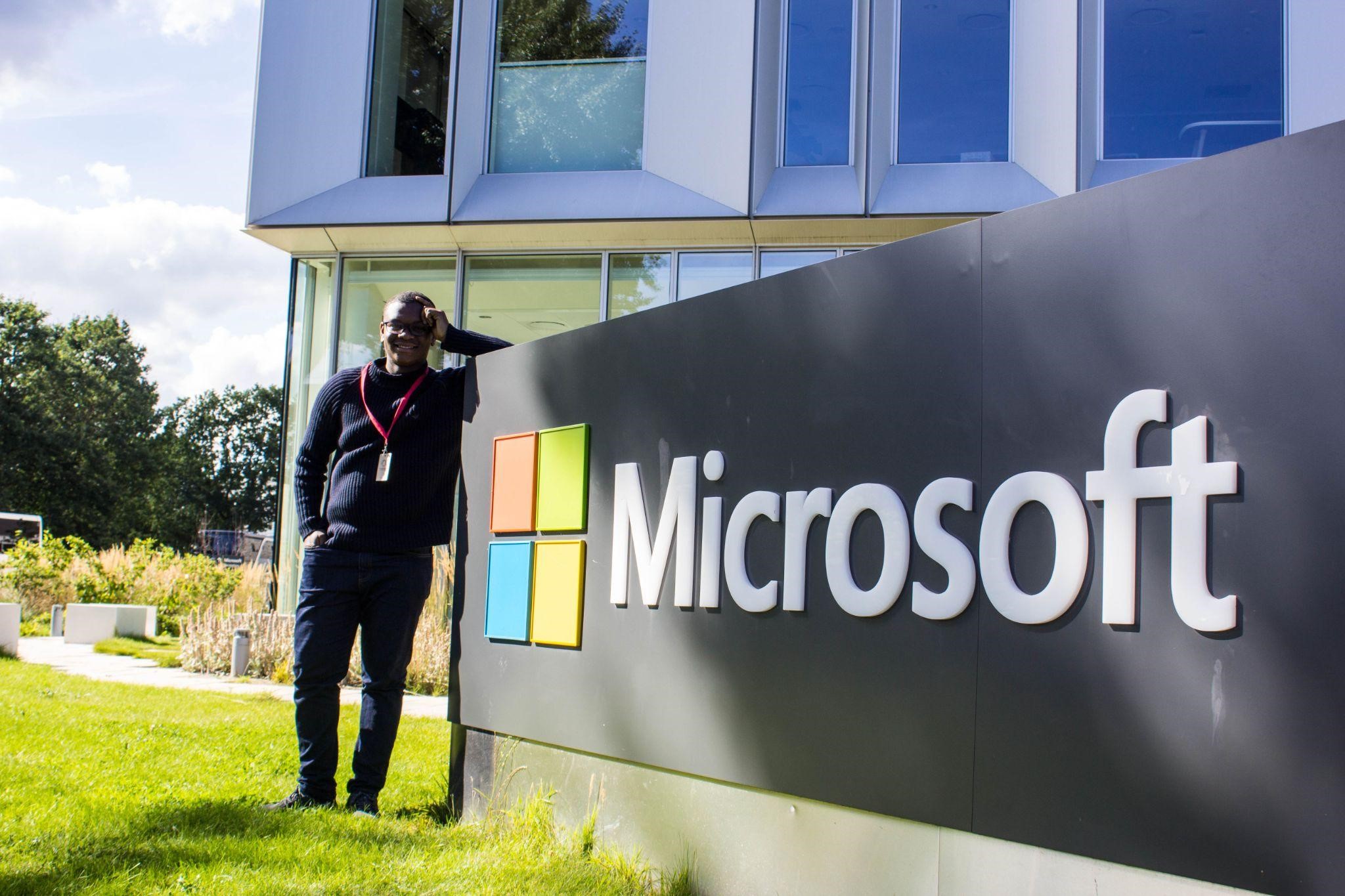 Author standing by the Microsoft sign in Copenhagen