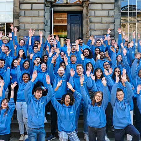 Photograph of a group of students, all in blue