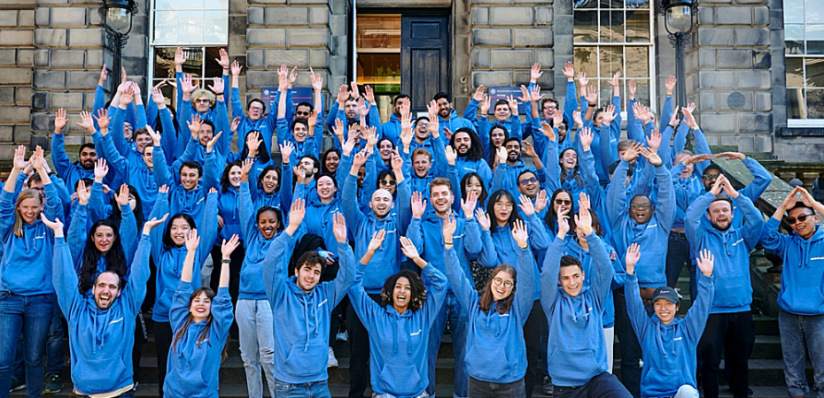 Photograph of a group of students, all in blue