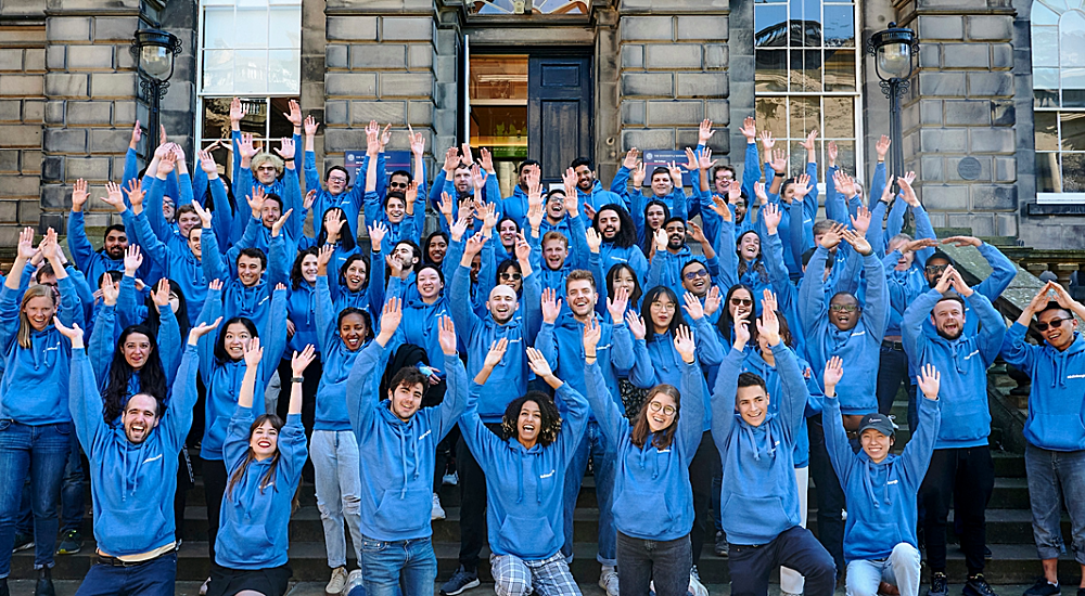 Photograph of a group of students, all in blue