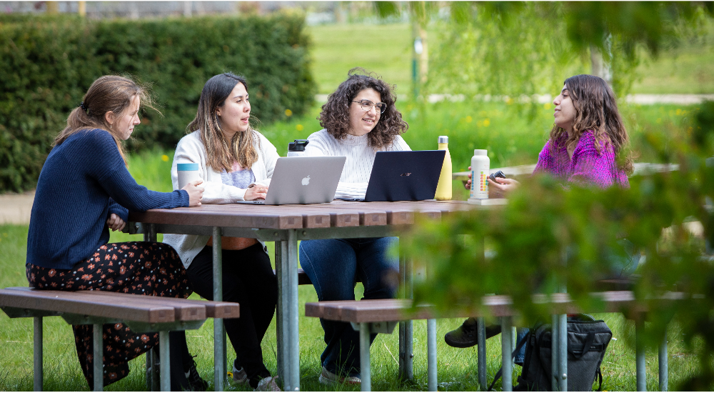 Students relax in the grounds of Edinburgh BioQuarter