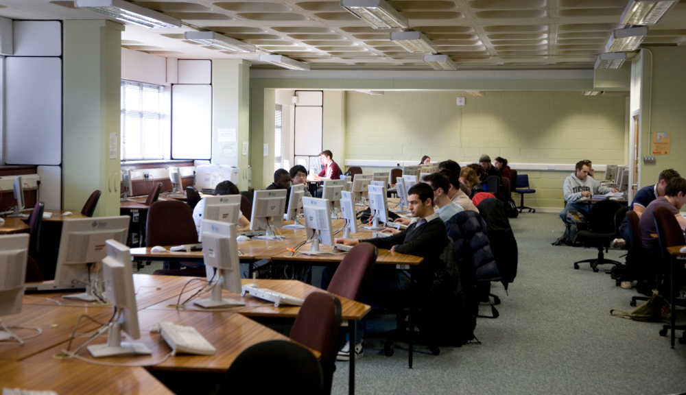 A photgraph showing a group of students working in the computer lab