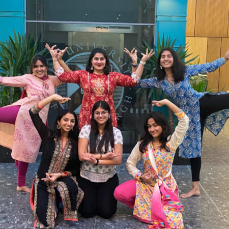 students posing as Bollywood Dance Troupe