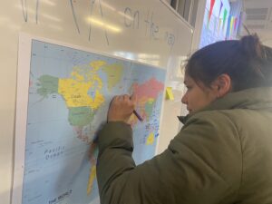 Student marking up a map 