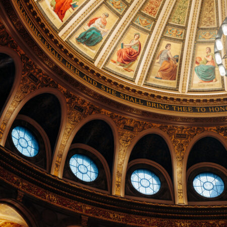 Fresco photo in McEwan Hall with light streaming in 4 circular windows