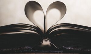 book opened with pages forming a heart