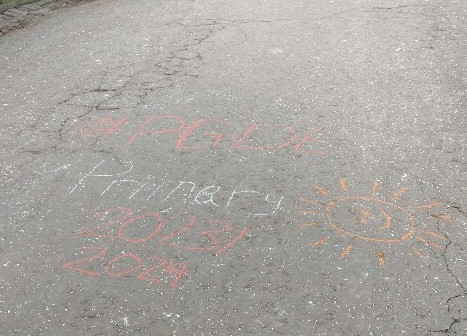 Chalk writing on pavement '#PGDE Primary 2023/2024'