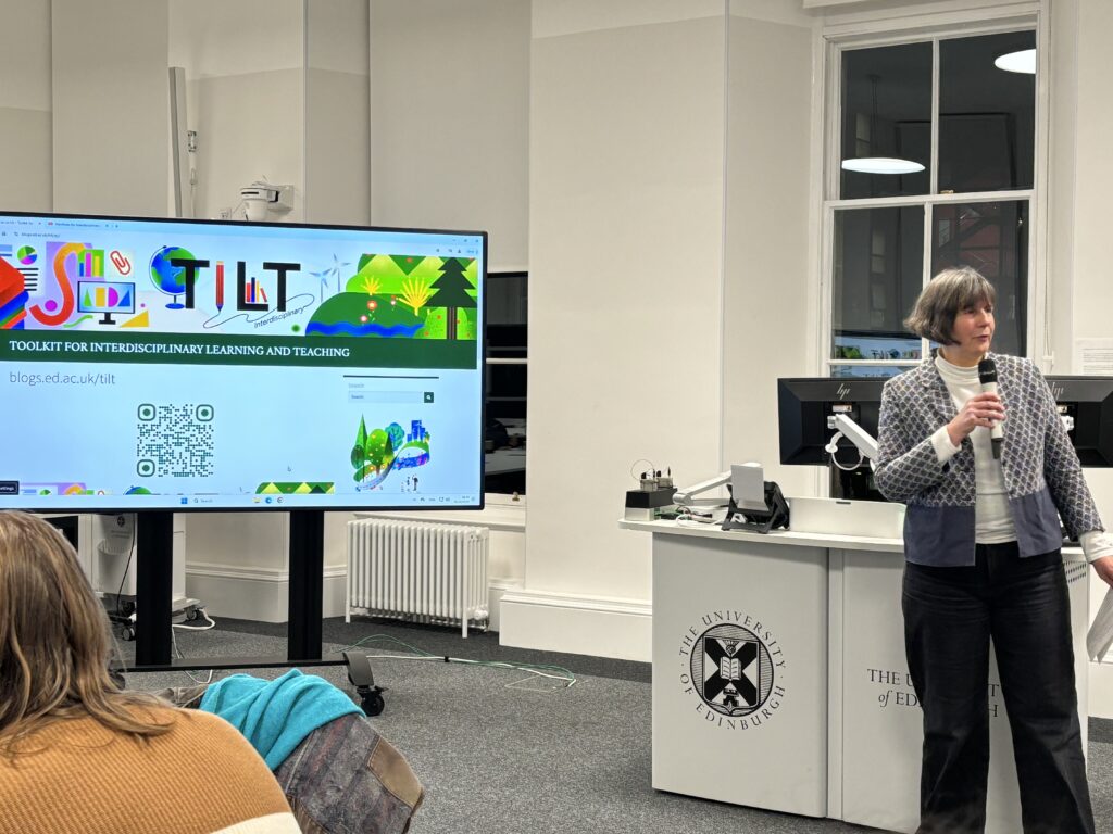 Photo of Sabine Rolle welcoming colleagues to TIlT launch event.