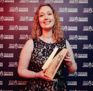 Photo of Brittany Blankship holding her award