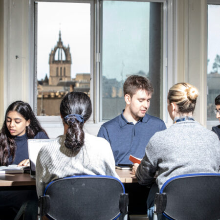 Students studying around a table in the Old Medical School.