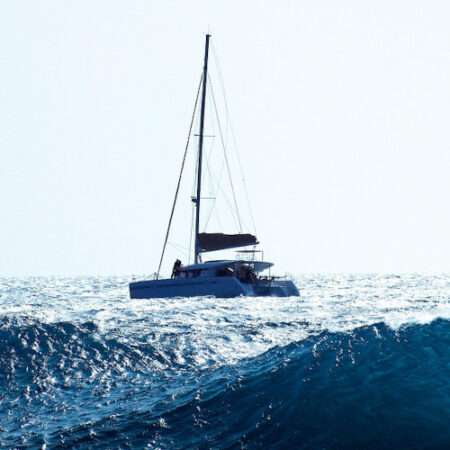 Photo of sail boat in wavy seas