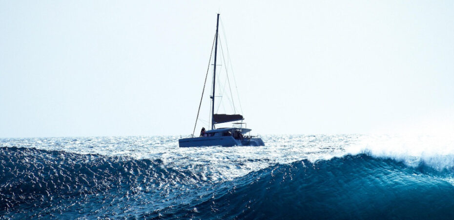 Photo of sail boat in wavy seas