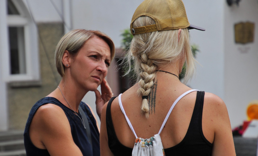 Photo of two woman talking