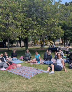 MASS Society enjoying a picnic on blankets in the Meadows