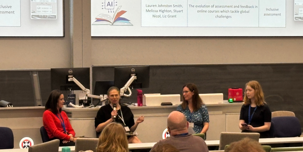 Photo of authors at panel presentation at the Conference