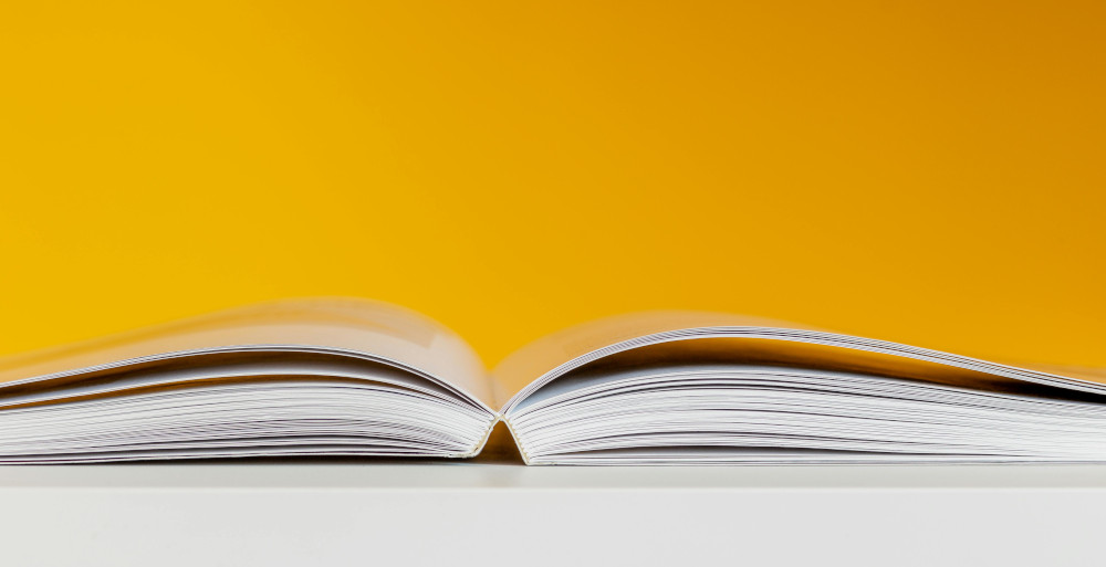 Photo of textbook open with orange background