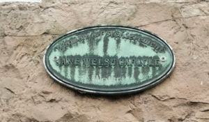 A plaque at 23 George Square commemorating the writer Jane Welsh Carlyle, in poor condition.