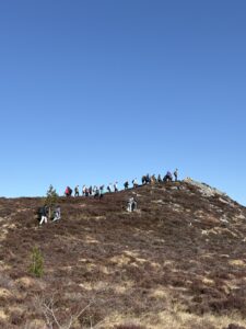Students ascending hilltop during visit to Abriachan.