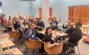 MASS Society social event - sitting around tables on chairs. 