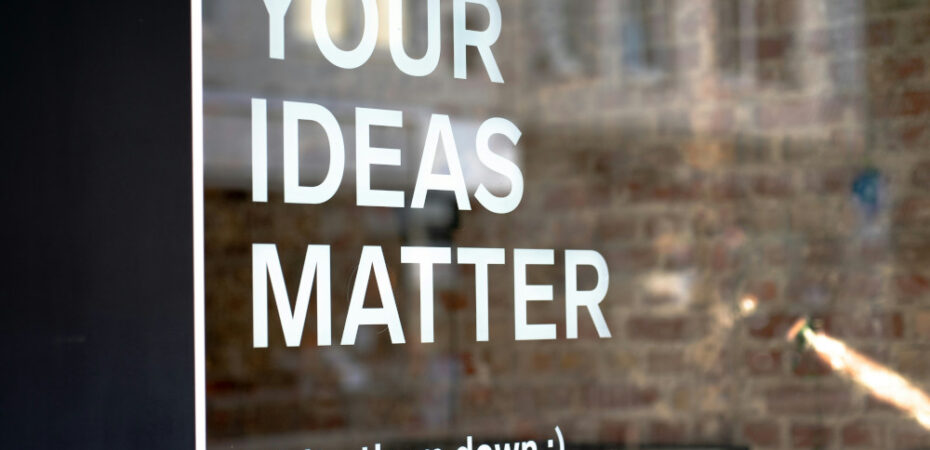 Window with words 'Your ideas matter - Write them down :)' written in white