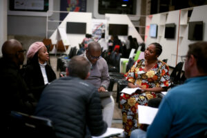 Sitting on chairs in circle talking