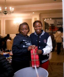 Two students exchanging gifts at Secret Santa