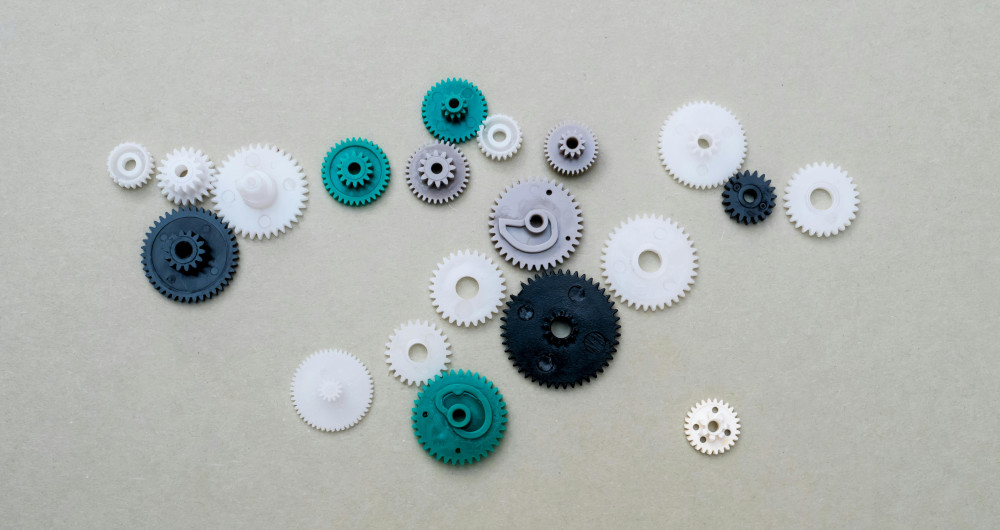 A photo of multicoloured plastic gears