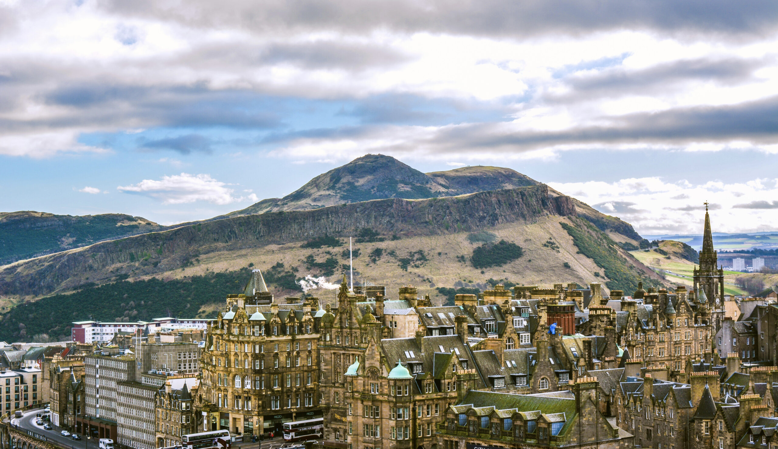Image of old Edinburgh buildings with a hill in the background
