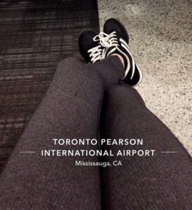 Student sitting in Toronto Pearson airport