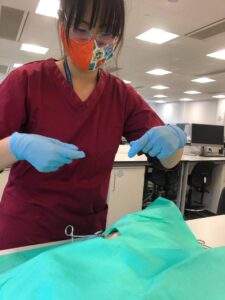 Student practising suturing techniques