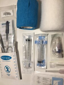 Suture kit with needles, syringes, vet wrap, scissors, thread