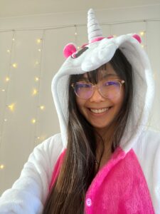 Vivian in unicorn onesie