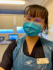 Student wearing veterinary personal protective equipment