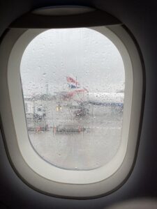 Airplane window with plane outside