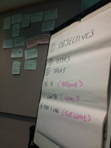 Flipchart at workshop reads: 1. Objectives, 2. Users, 3. Tasks